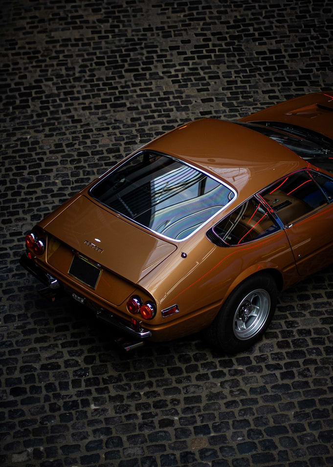 Classic Bronze Ferrari on Cobblestone