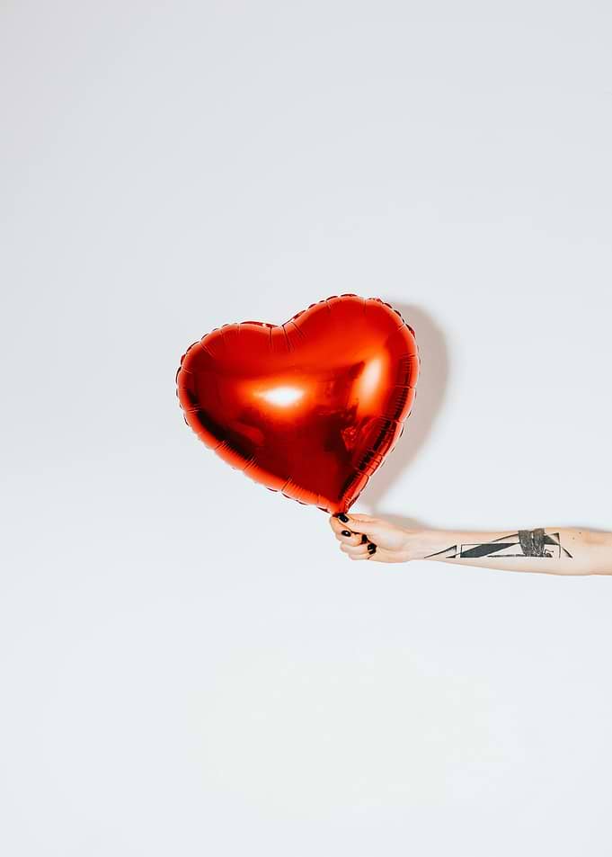 Red Heart Balloon with Tattooed Arm