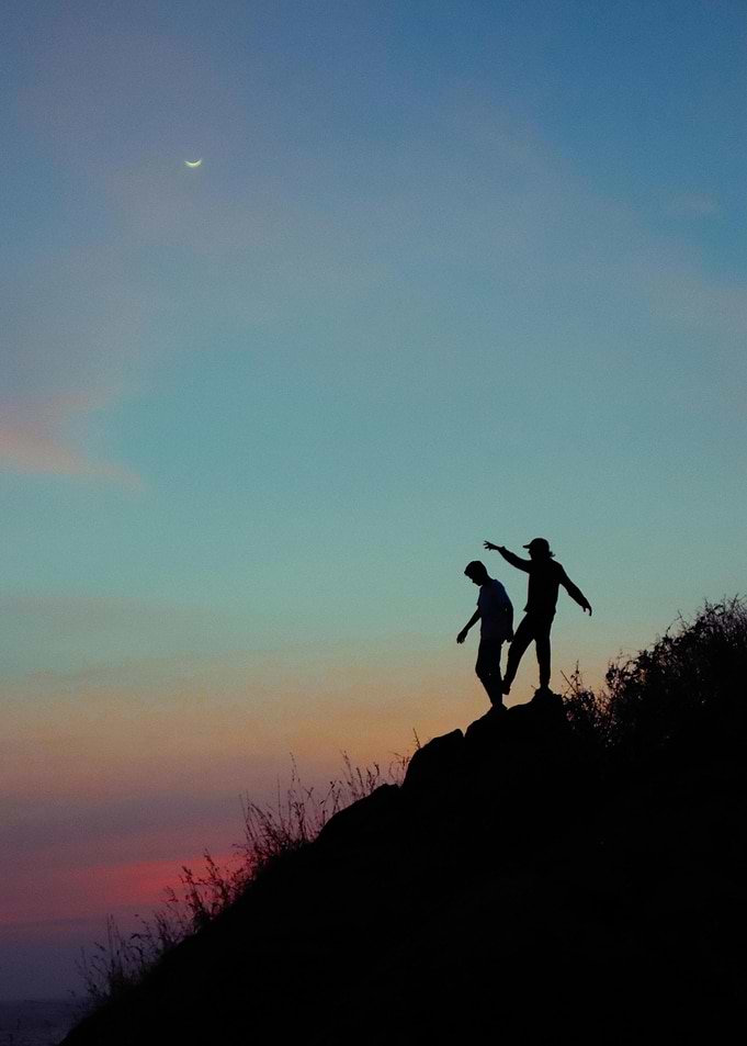 Silhouette of Two People at Sunset