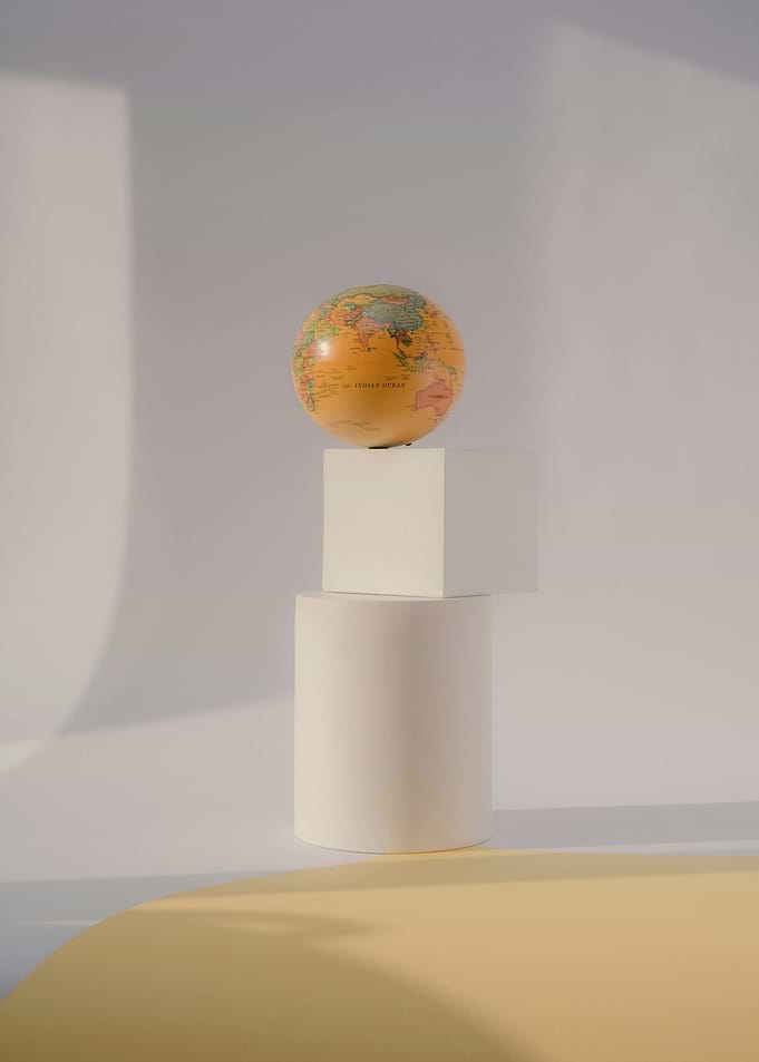 Globe on Geometric Shapes Still Life
