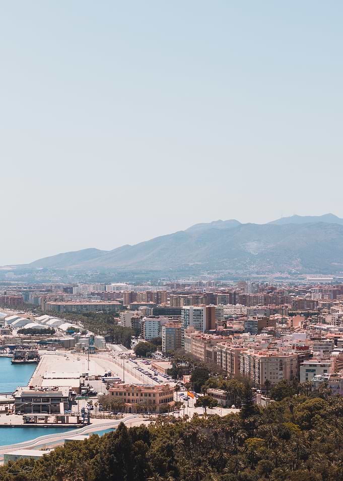 Malaga Cityscape with Mountains and Port