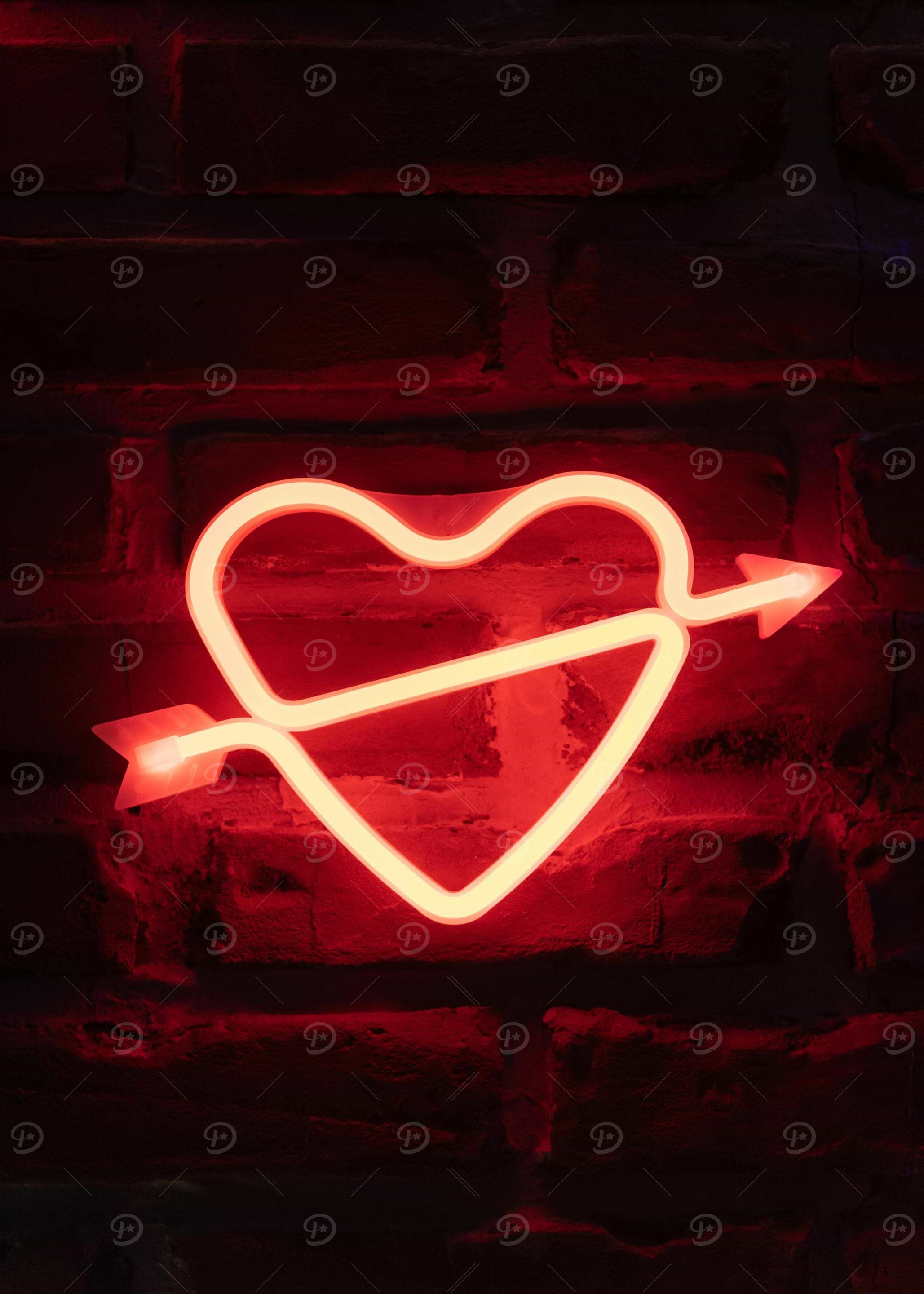 Red Neon Heart with Arrow on Brick