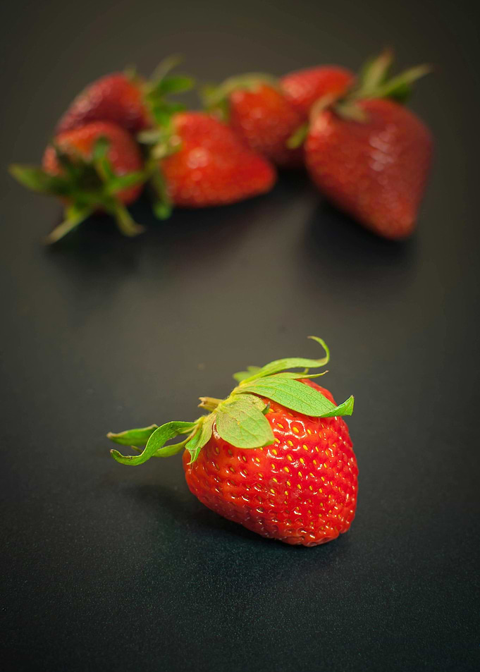 Fresh Strawberries on Dark Surface
