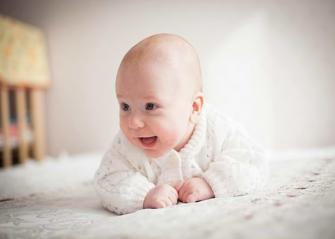Happy Baby in White Sweater
