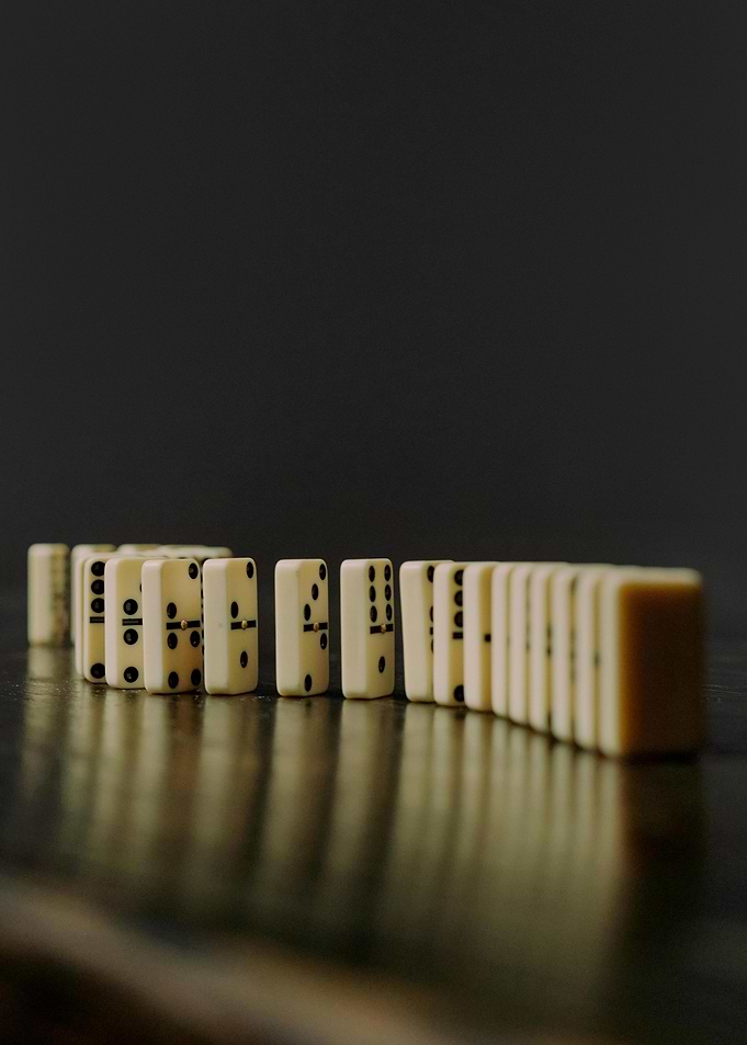 Dominoes lined up on a table