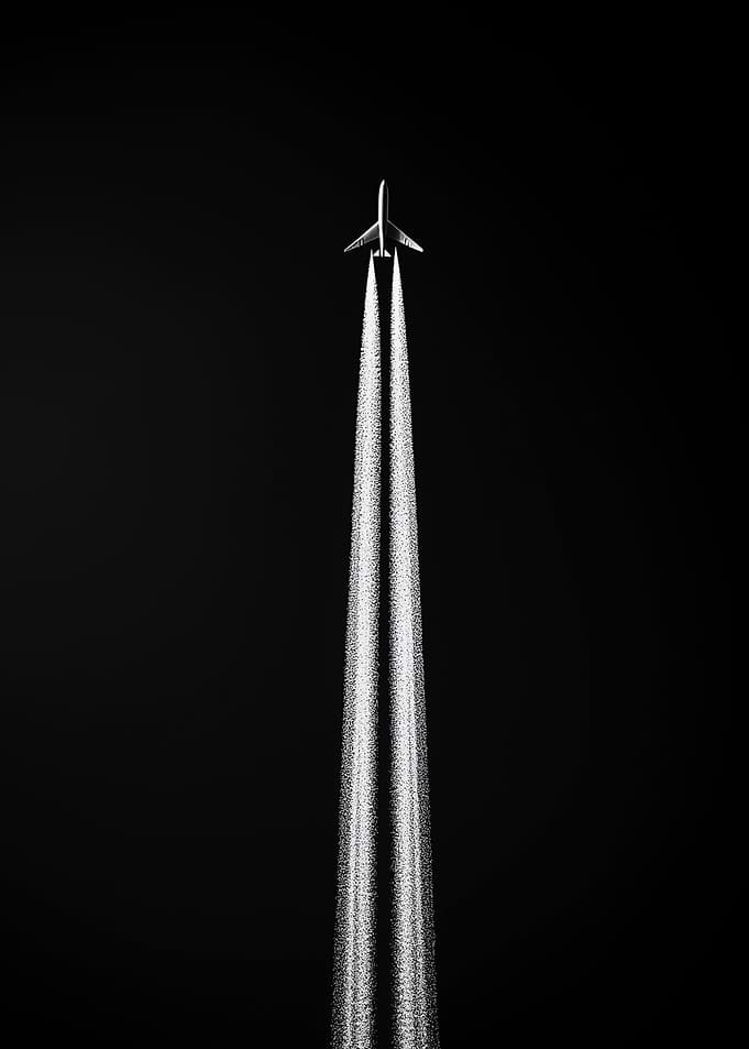 Airplane with Contrails in Black and White