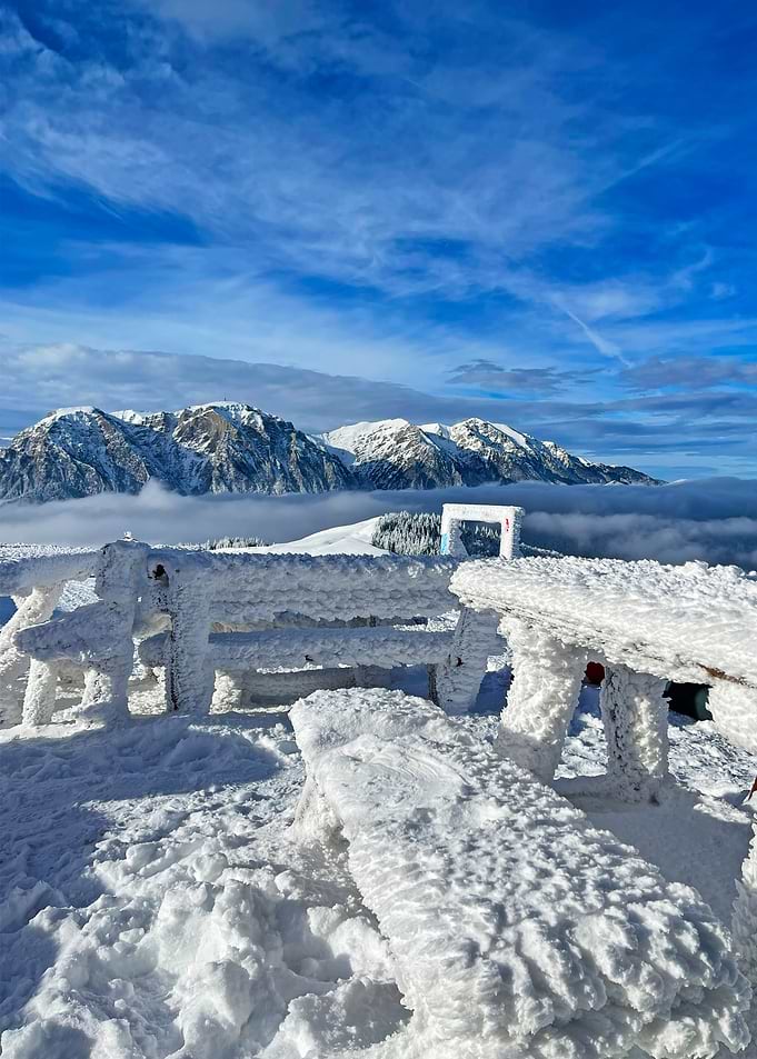 Snowy Mountain Vista with Iced Picnic Table