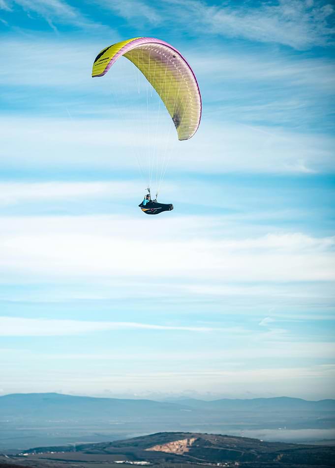 Paragliding in a blue sky