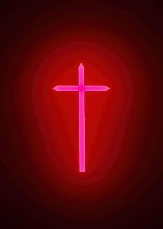 Glowing Pink Cross on Red Background