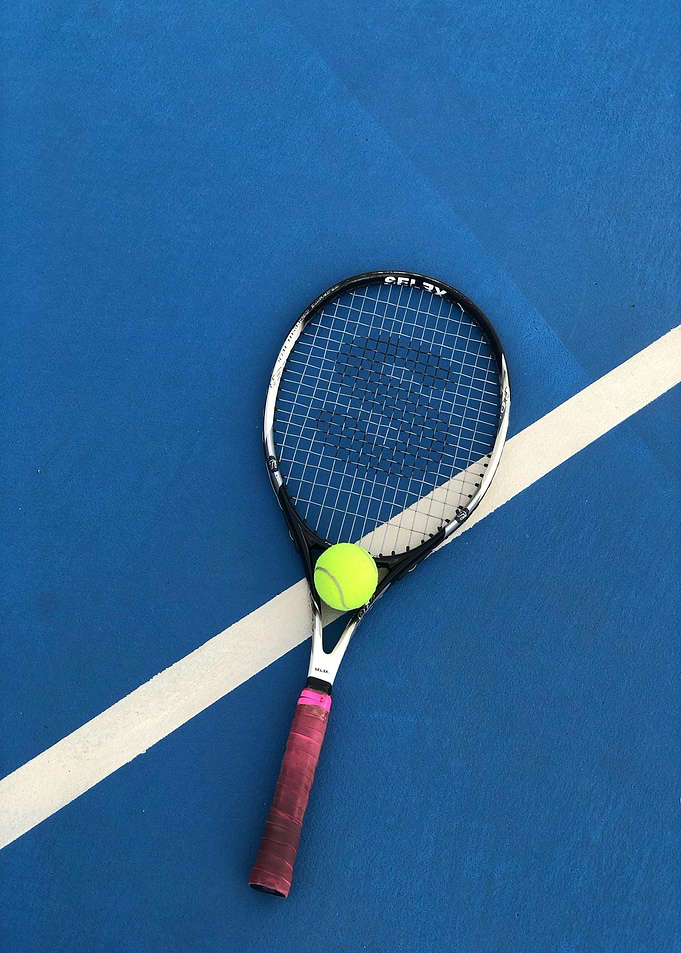Tennis Racket and Ball on Court
