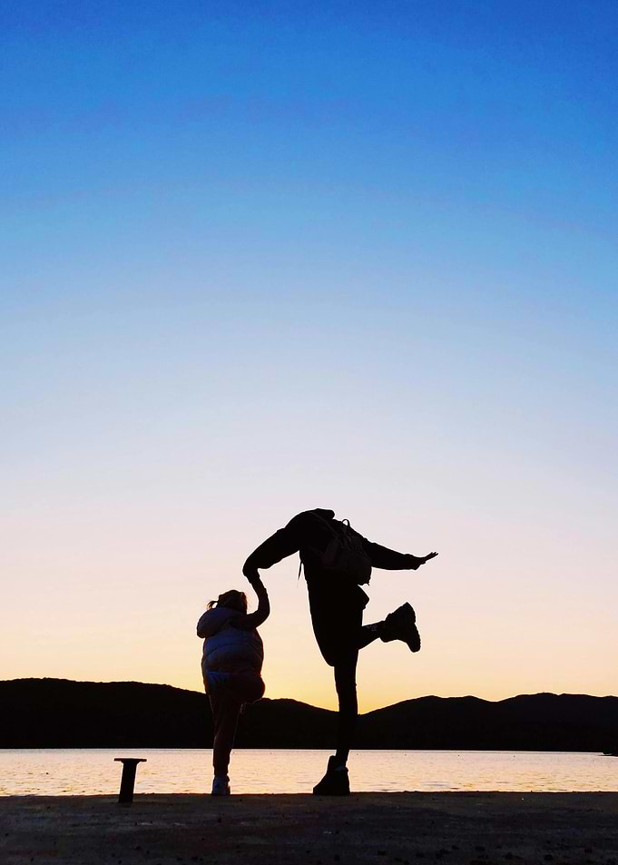 Silhouette of people at sunset