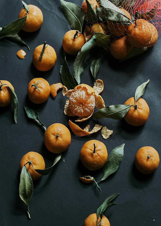 Tangerines with Leaves on Dark Background