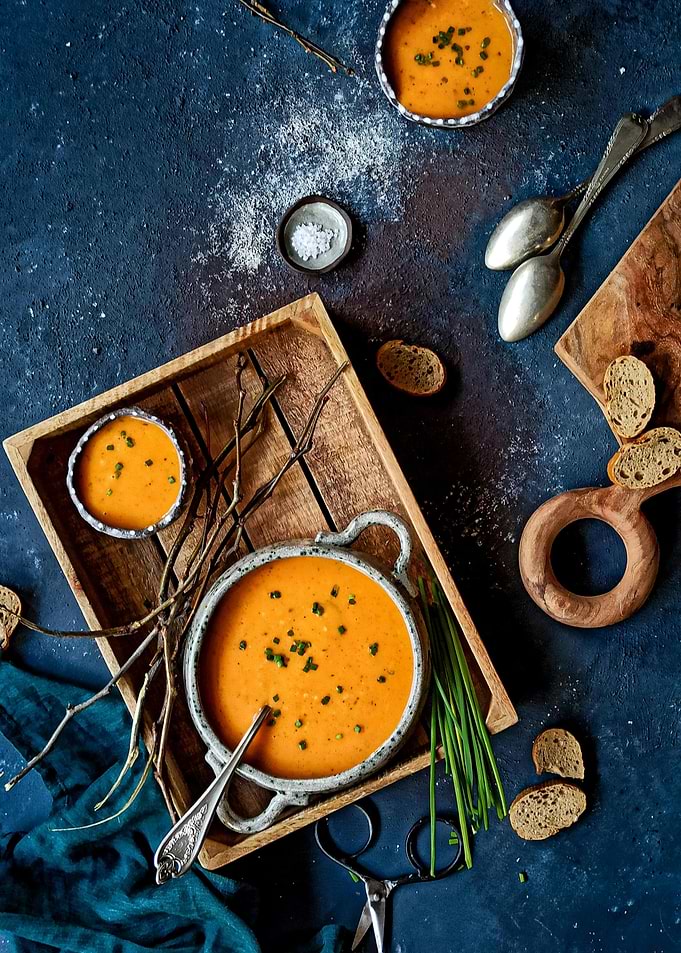 Overhead shot of orange soup bowls