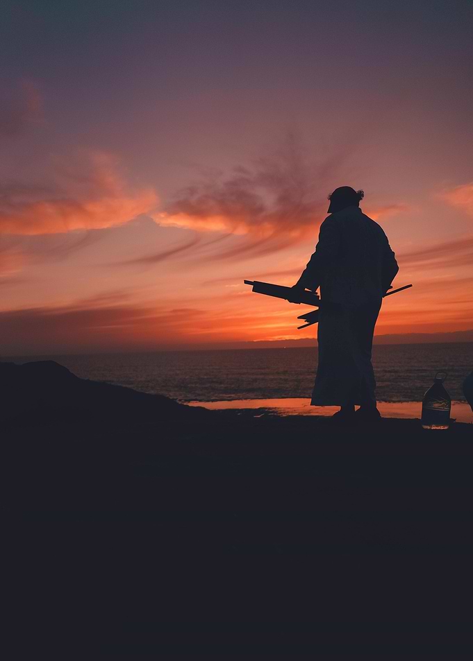Silhouette of a person at sunset