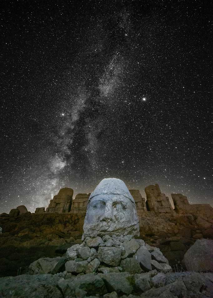 Stone Head Under Starry Night Sky