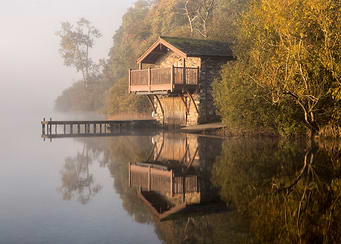 Lakeside Boathouse in Autumn Mist