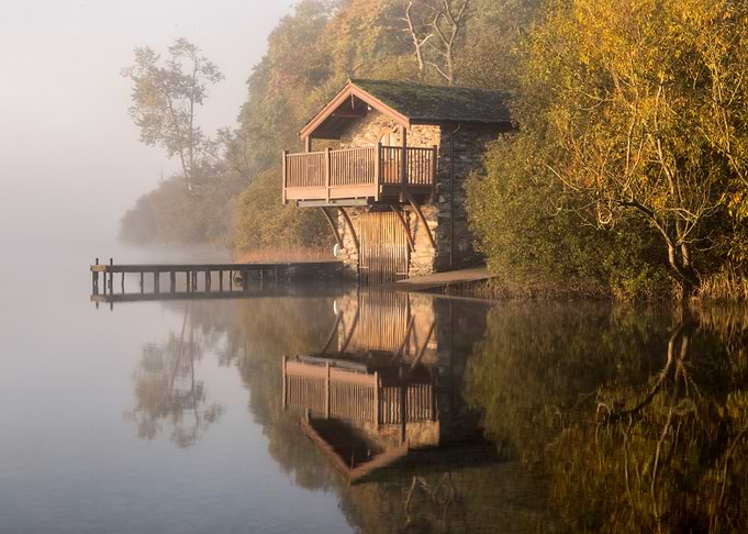 Lakeside Boathouse in Autumn Mist