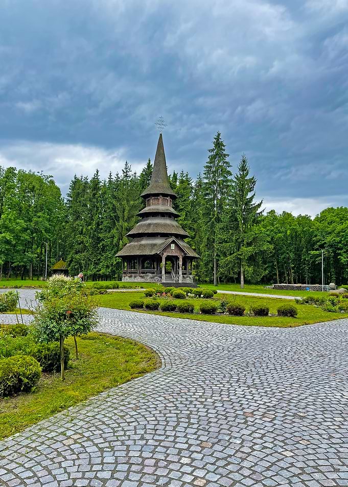 Wooden Church in Green Landscape