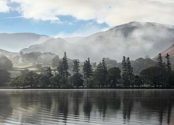 Misty Lake Landscape with Mountain Backdrop
