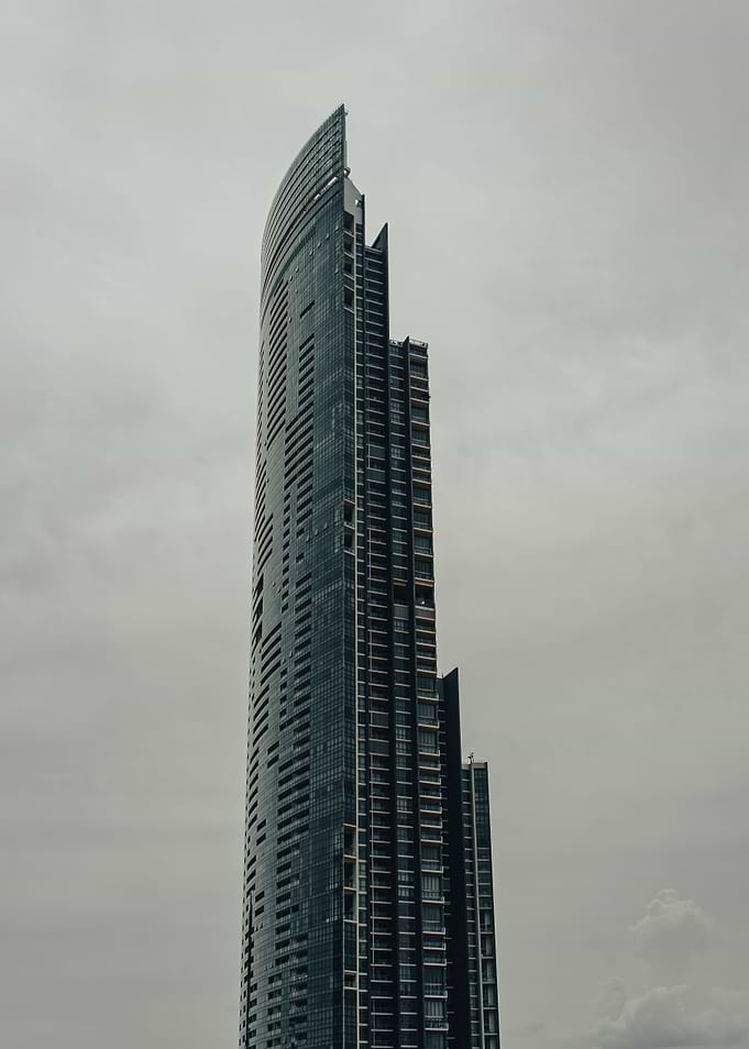 Modern Skyscraper Against Overcast Sky