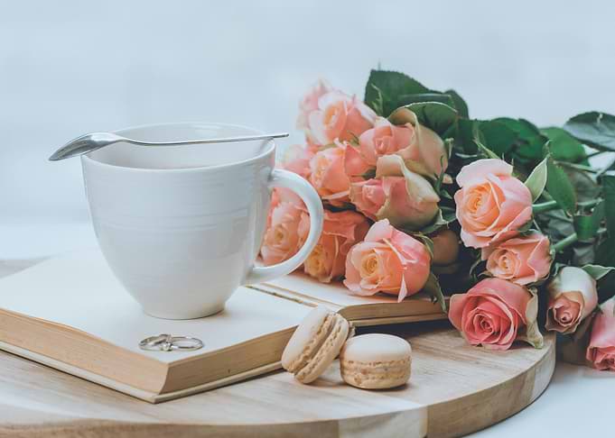 Coffee, Roses, and Macarons Still Life