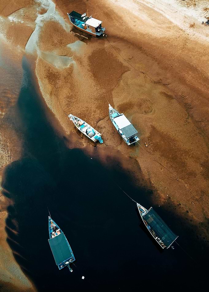 Aerial View of Boats on Riverbank