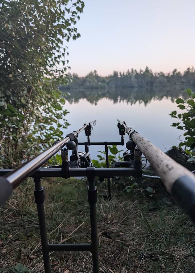 Fishing rods by a calm lake