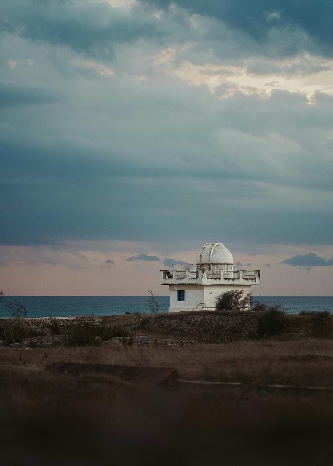 Coastal Observatory Under Cloudy Sky
