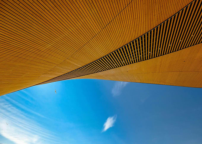 Architectural Wood Structure Against Blue Sky