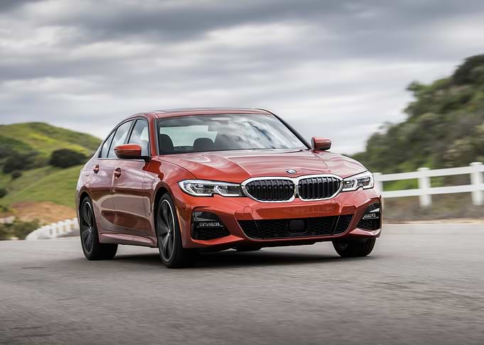 Red BMW 3 Series on Road