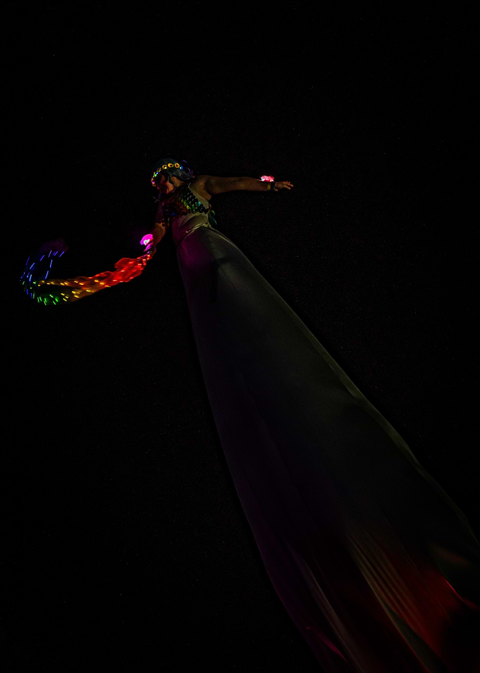 Performer with LED lights in the dark