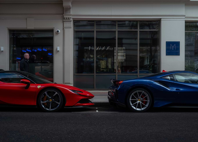 Red Ferrari SF90 and Blue Ferrari 488 Pista