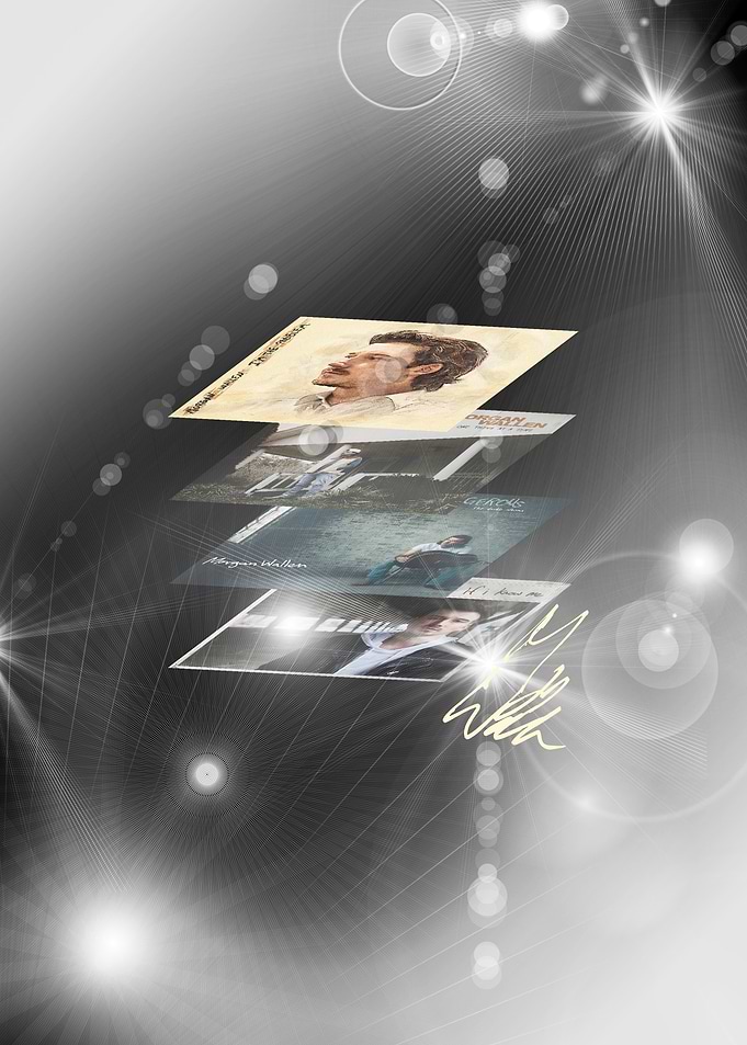 Stack of album covers with signature