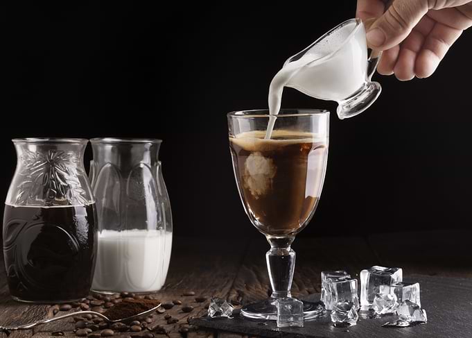Iced Coffee with Milk Pouring