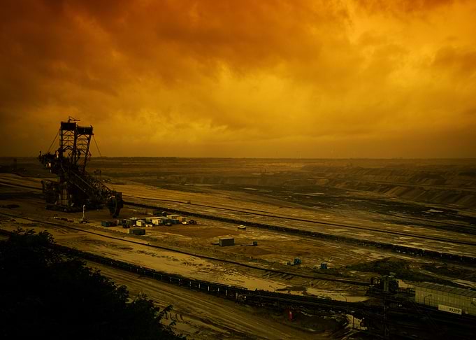 Open-pit mining landscape with machinery