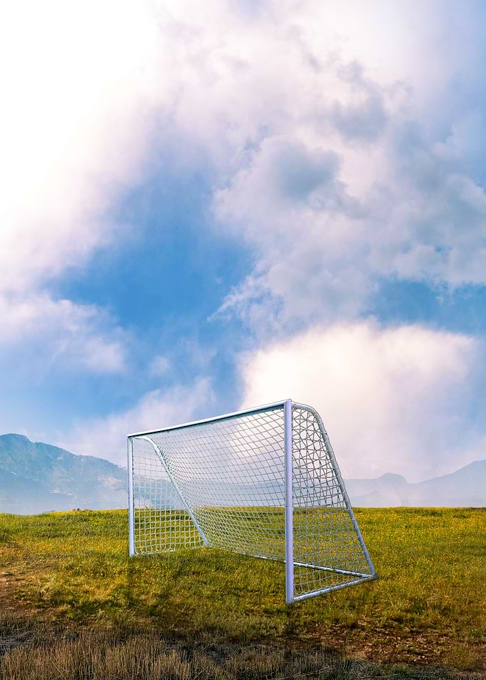 Soccer Goal on Field with Cloudy Sky