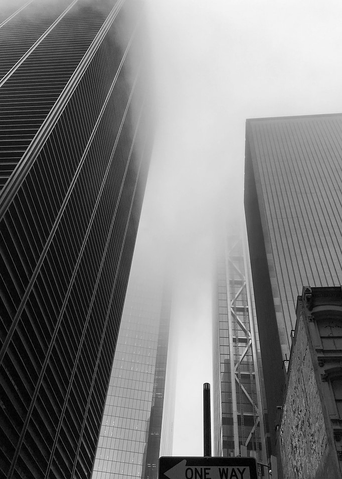 Foggy Cityscape: Black and White Buildings
