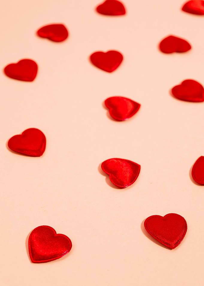 Red Hearts on Light Pink Background