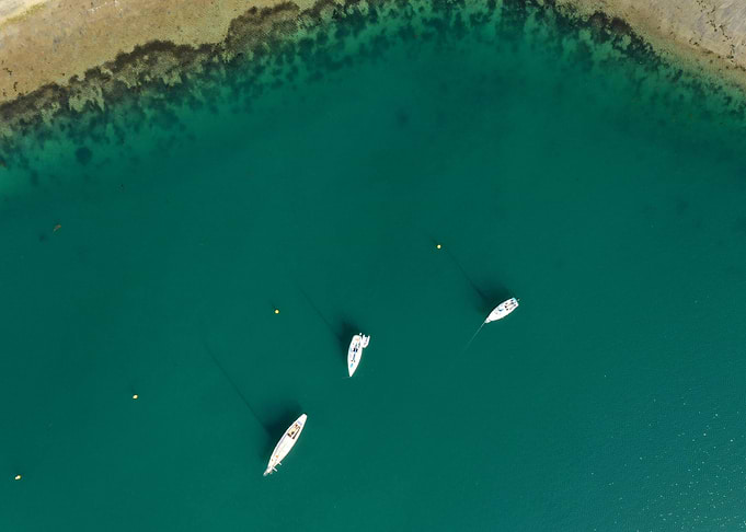Aerial View of Boats in Turquoise Water
