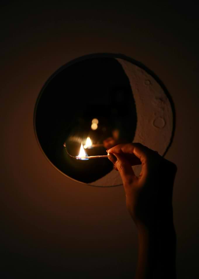 Match Flame and Moon Reflection