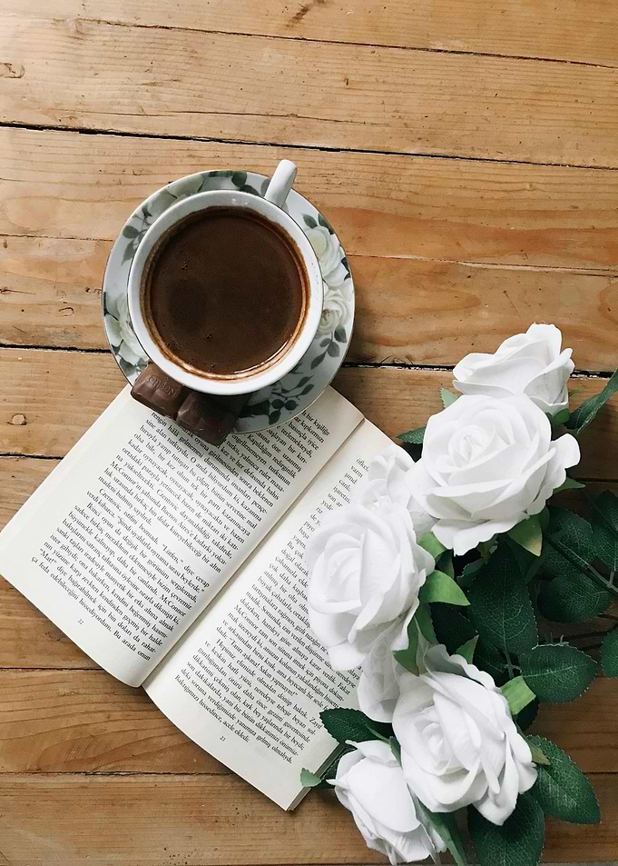 Coffee, Book, and White Roses Still Life
