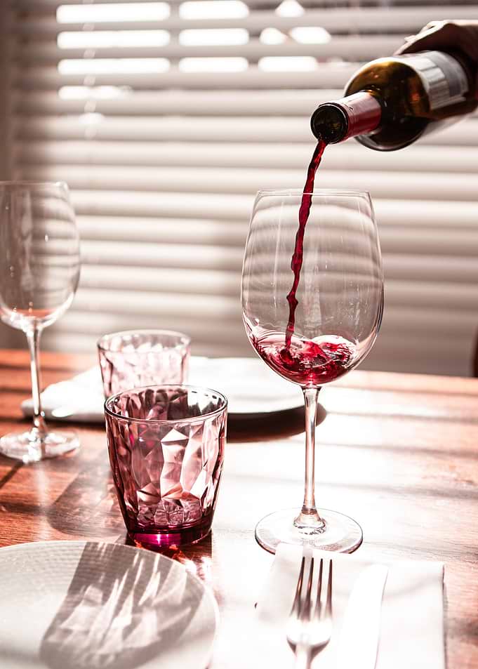 Pouring Red Wine into Glass