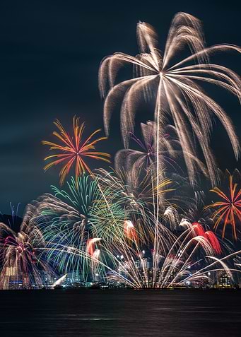 Fireworks Display Over City at Night