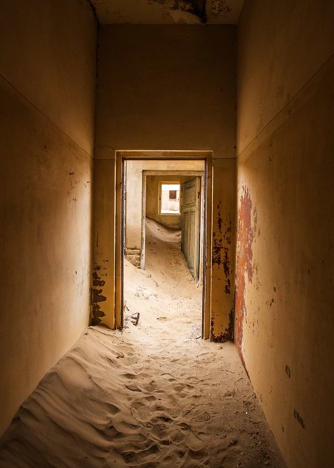 Sandrooms of Kolmanskop , Doors to Nowhere Sand-filled abandoned building interior
