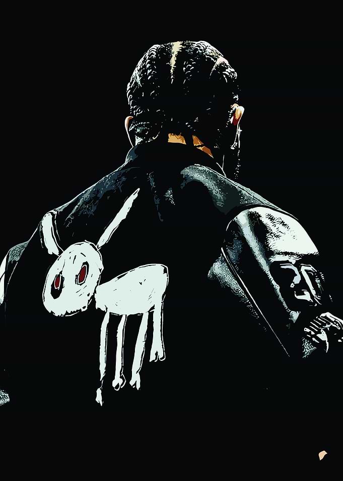 Man with Braids and Graphic Jacket