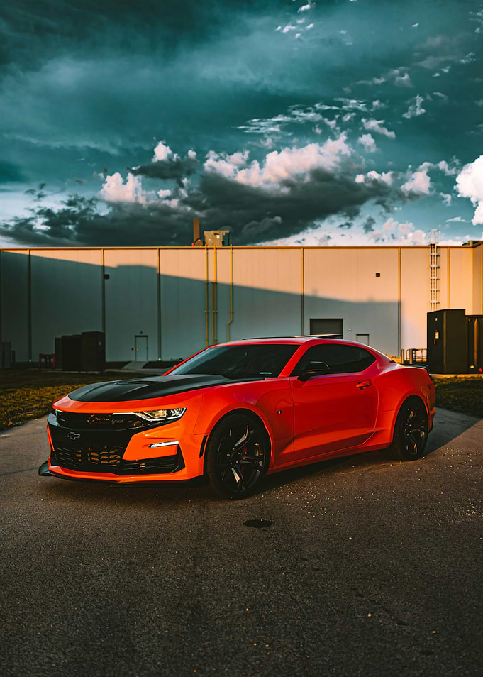 Red Chevrolet Camaro parked outdoors
