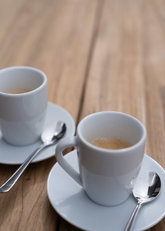 Two Cups of Espresso on Wood