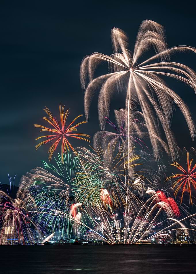 Fireworks Display Over City at Night