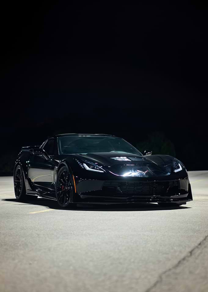 Sleek Black C7 z06Corvette at Night