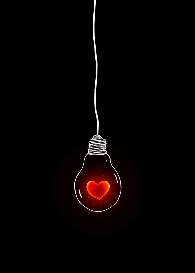 Heart Lightbulb on Black Background